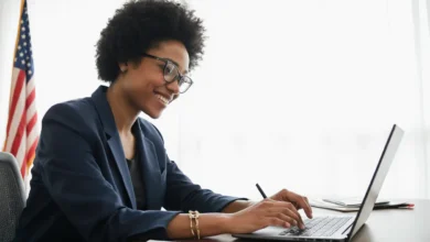 Smiling person working with a green card lawyer online to apply for green card, filling out forms with ease.
