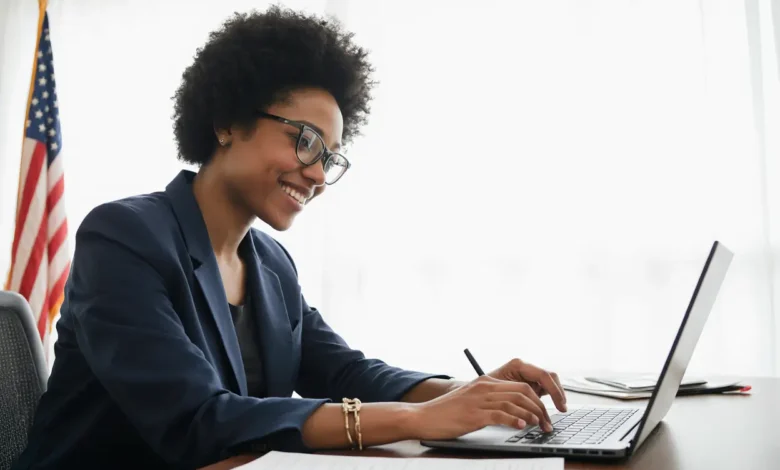 Smiling person working with a green card lawyer online to apply for green card, filling out forms with ease.